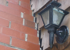 A tilting chimney in Griffin showing serious foundation damage.