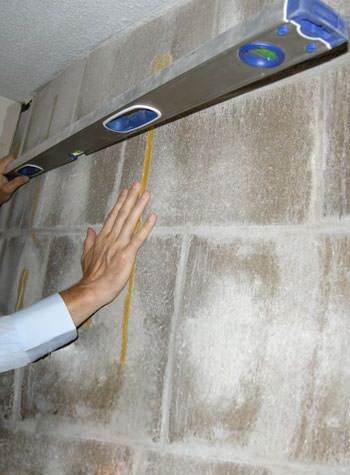 severe foundation wall failure symptoms of a basement wall in Eatonton