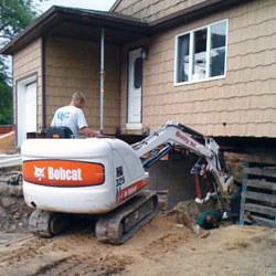 Excavating to expose the foundation walls and footings for a replacement job in Hinesville