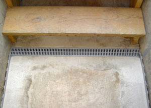 Our grated drain system installed on a leaking basement staircase in Bonaire.