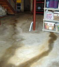 Flooding entering a basement through a floor crack in Johns Island