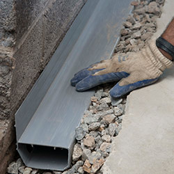 installing a drain tile system in a Bluffton home